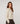 Chaqueta de punto corta con hombreras - Beige jaspeado